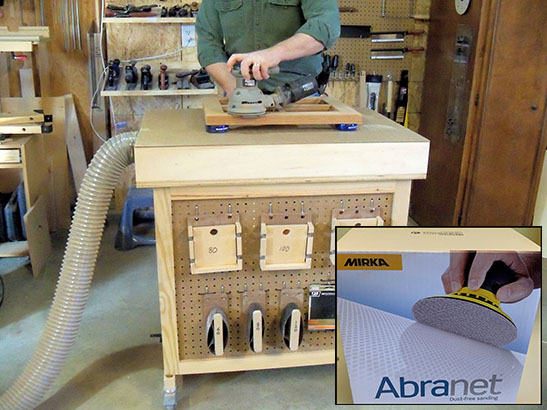 2Sand's downdraft sanding table with an inset image of an Abranet disc box