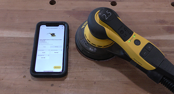 A sander and cell phone connected by Bluetooth