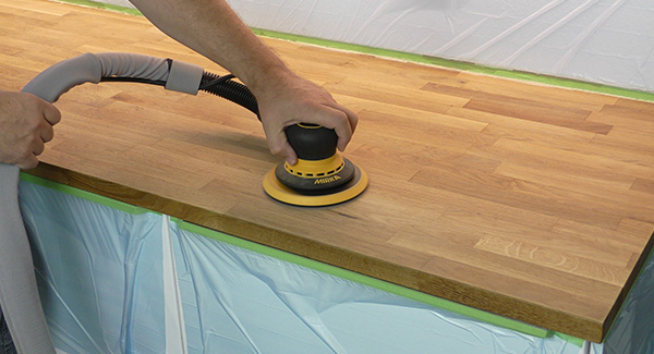 Sanding the countertop using Abranet and dust extraction